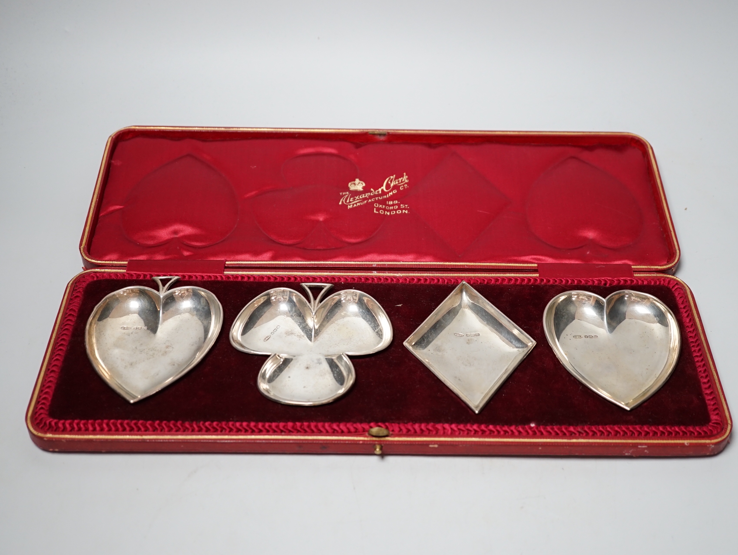 An Edwardian cased set of four novelty silver playing card suite shaped ashtrays, William Mammatt & Son, Sheffield, 1904, heart dish 94mm.